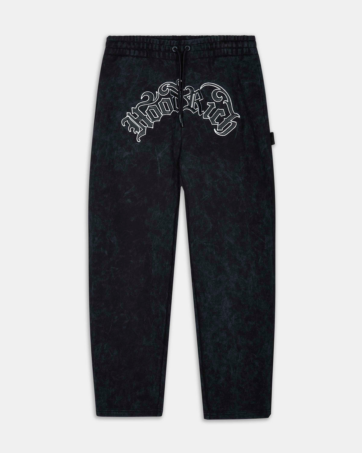 Black acid-wash sweatpants featuring a white gothic-style 'Hooligan' logo printed across the upper left hip, displayed flat against a light gray background.