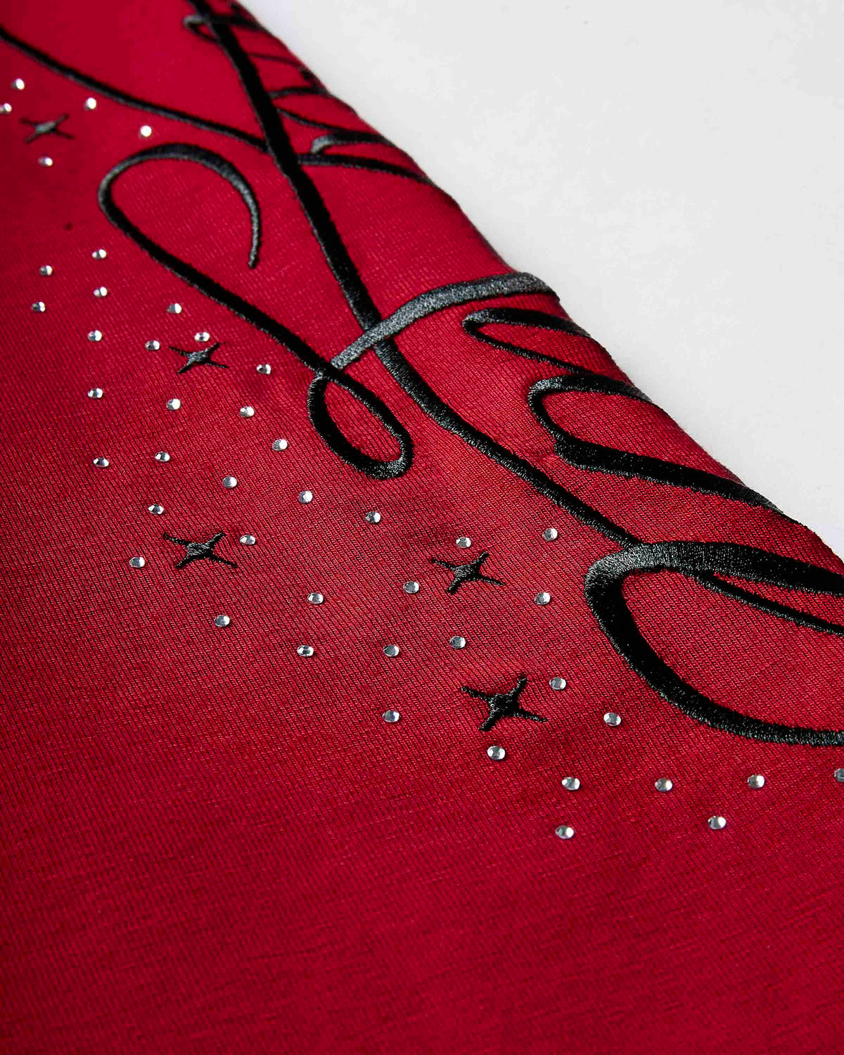 Displays the red 'hoodrich' branded Gleam Flare Legging featuring the hoodrich branding details