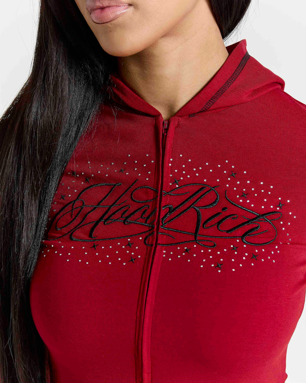 Displays a model wearing the red 'hoodrich' branded Gleam V2 Fitted Z/T Hoodie featuring the hoodrich branding