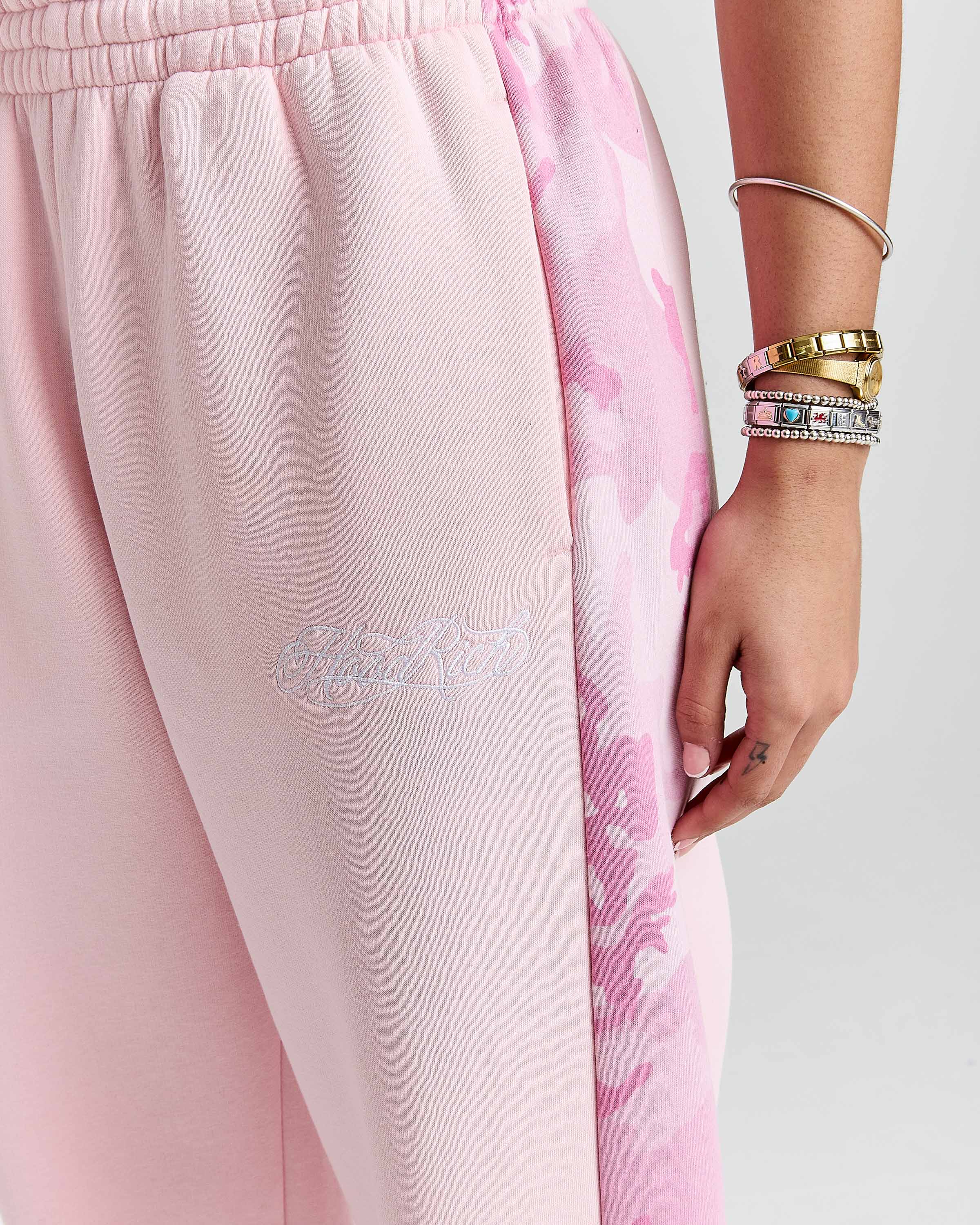Displays a model wearing the Pink "Hoodrich' branded women's Field Full Tracksuit