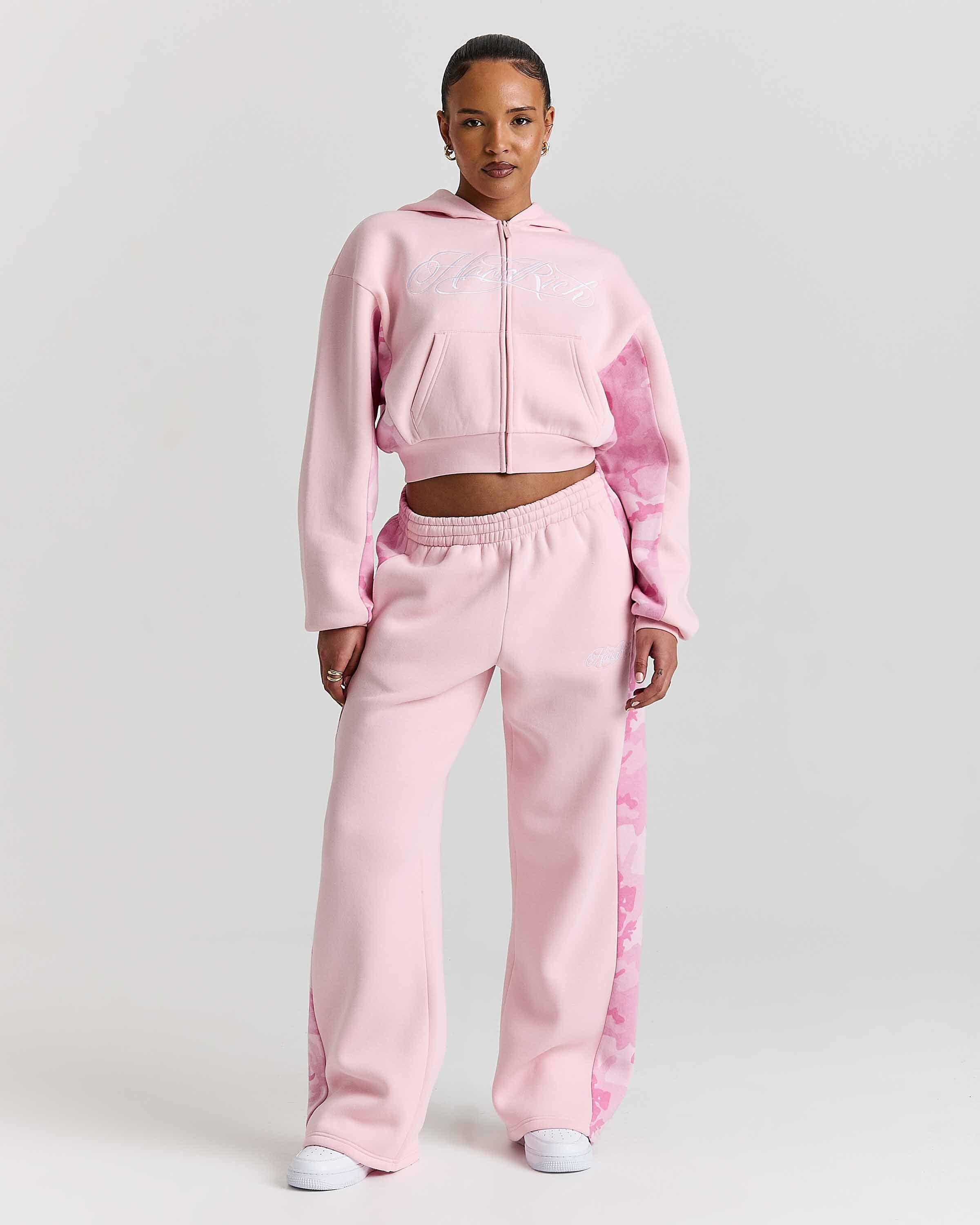 Displays a model wearing the Pink "Hoodrich' branded women's Field Full Tracksuit