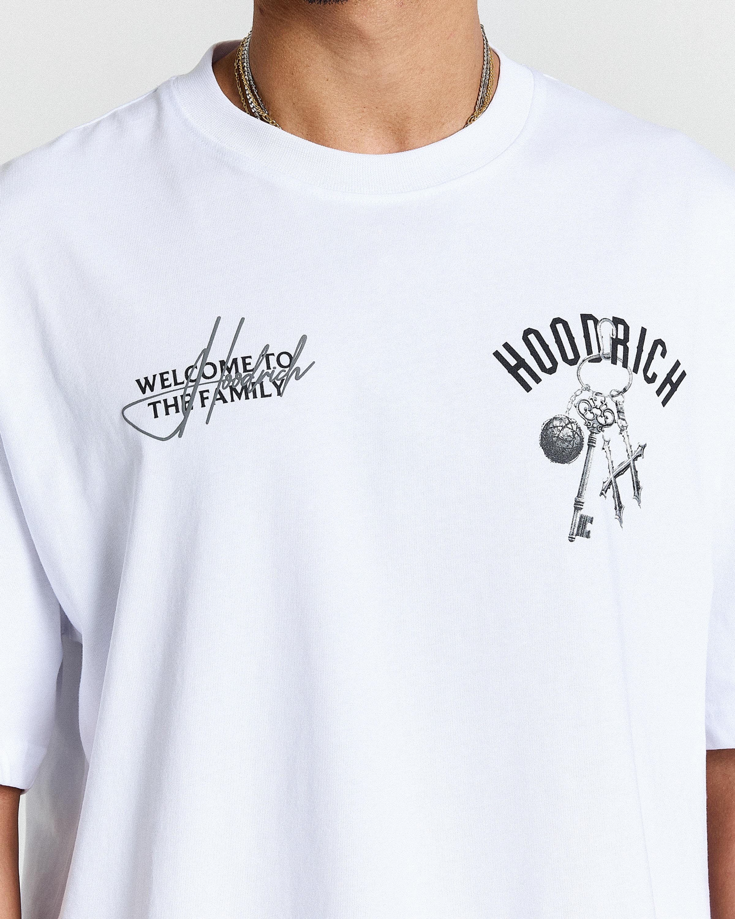 White t-shirt with black graphics and text on a plain background