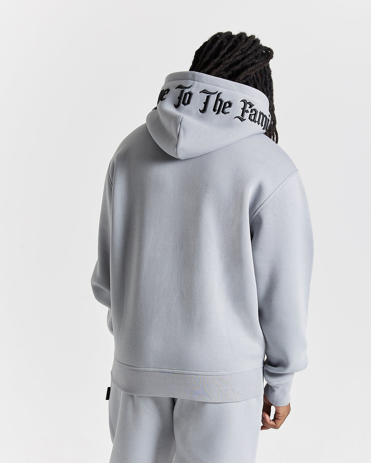 Displays a model wearing the Grey 'Hoodrich' branded men's Dark Full Tracksuit