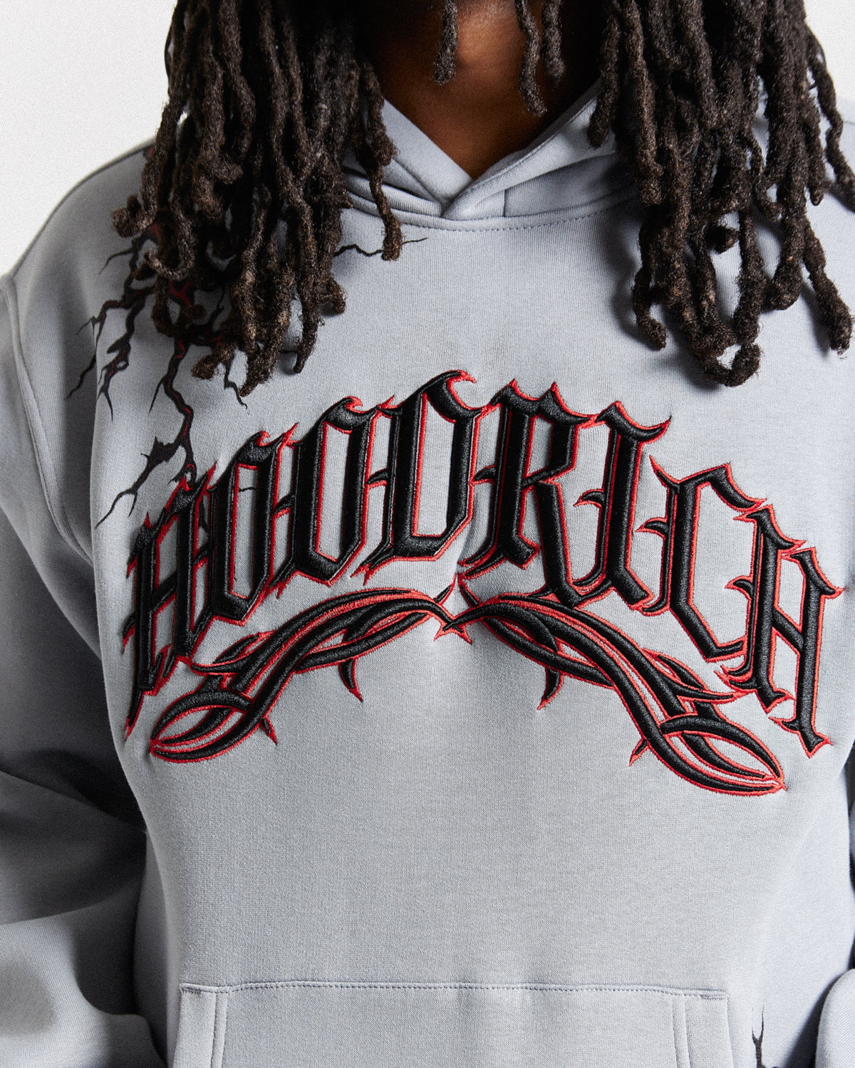 Displays a model wearing the Grey 'Hoodrich' branded men's Dark Full Tracksuit featuring the hoodrich branding