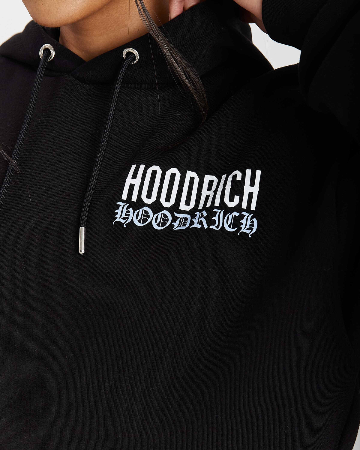 Displays a model wearing the Black 'Hoodrich' branded women's Flex Full Tracksuit featuring the hoodrich branding