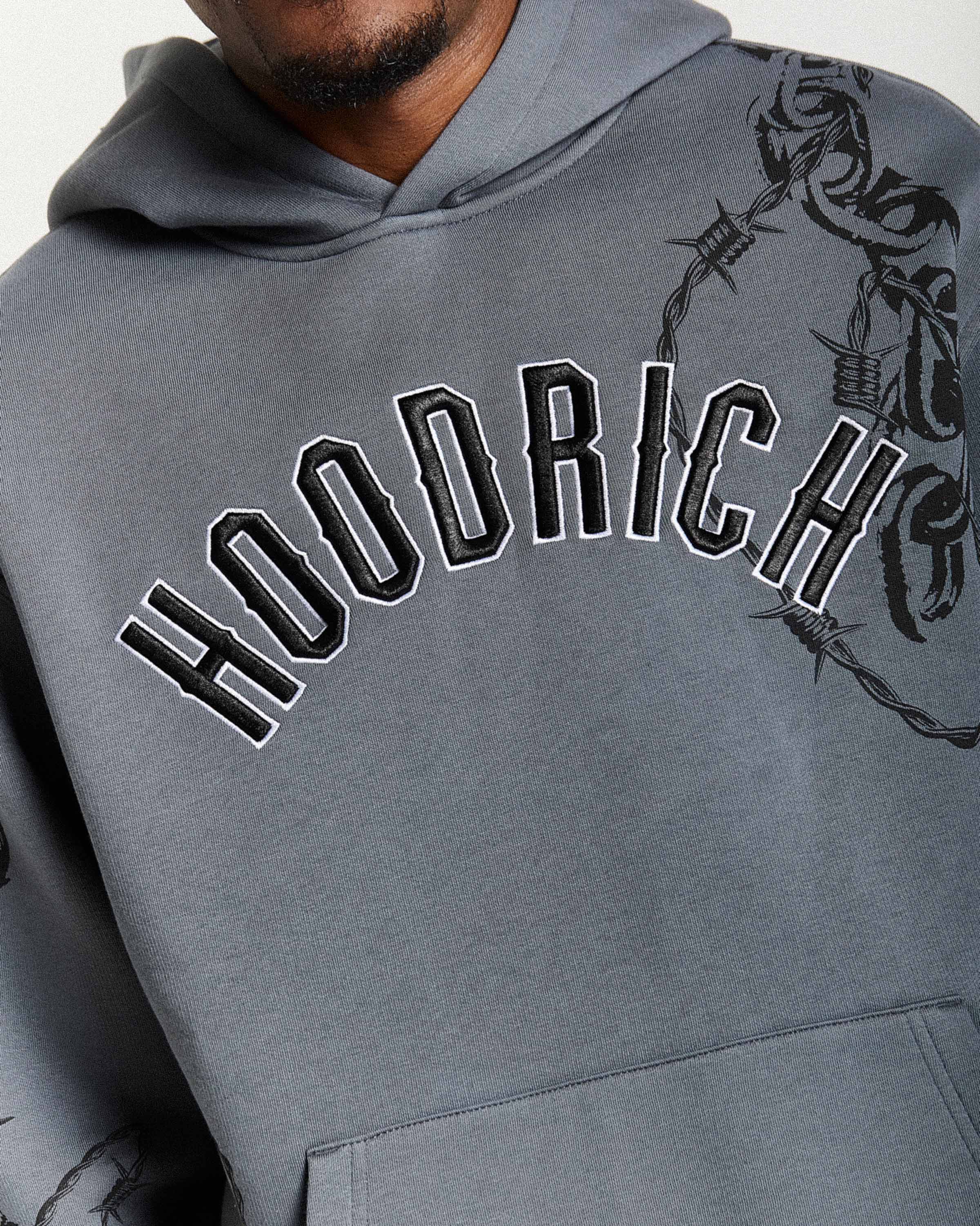 Gray hoodie with 'Hoodrich' text and barbed wire design on a white background