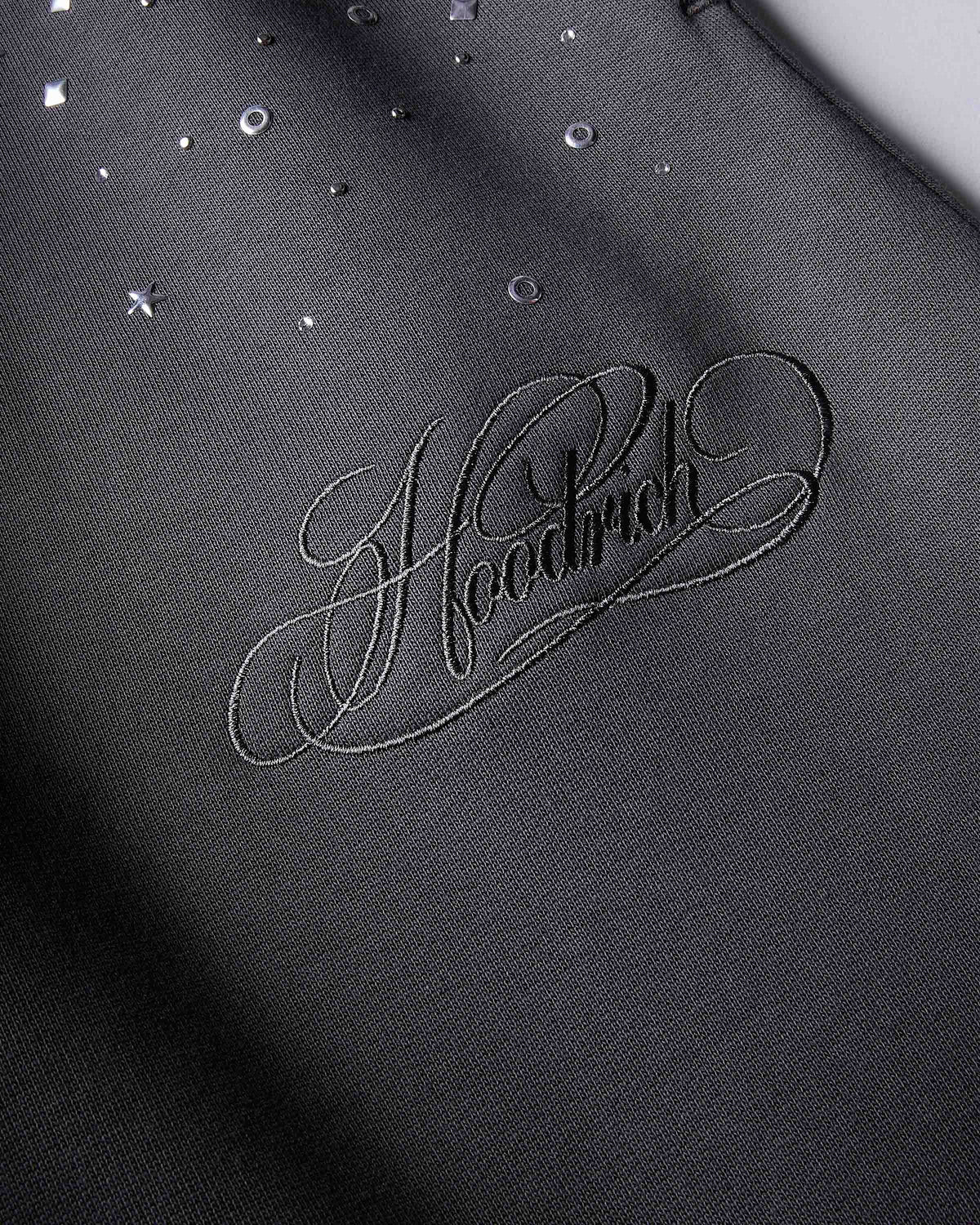 Displays the grey 'Hoodrich' branded women's Clash Full Tracksuit featuring the details on the hoodrich branding 