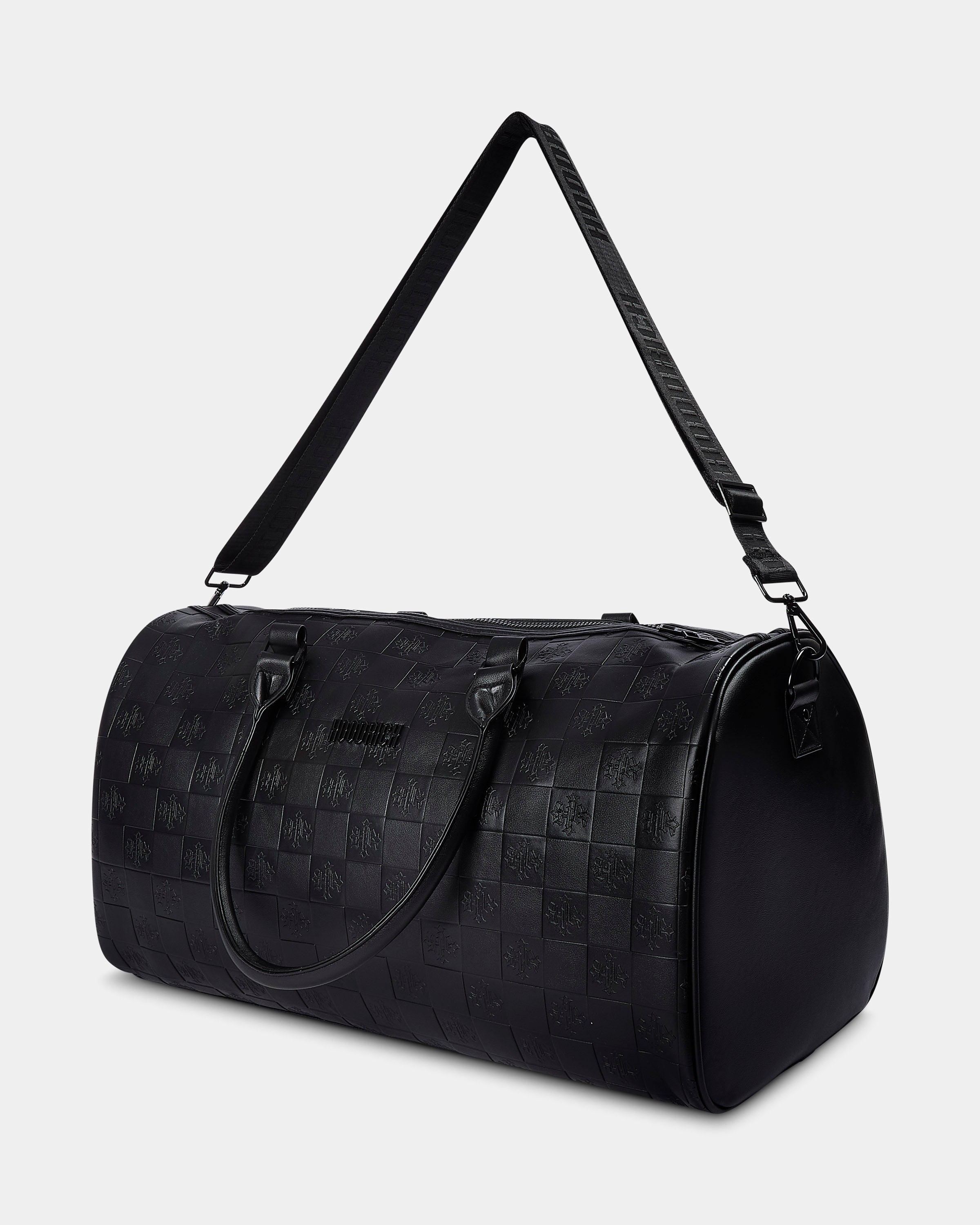 Black textured duffel bag with a strap on a light gray background
