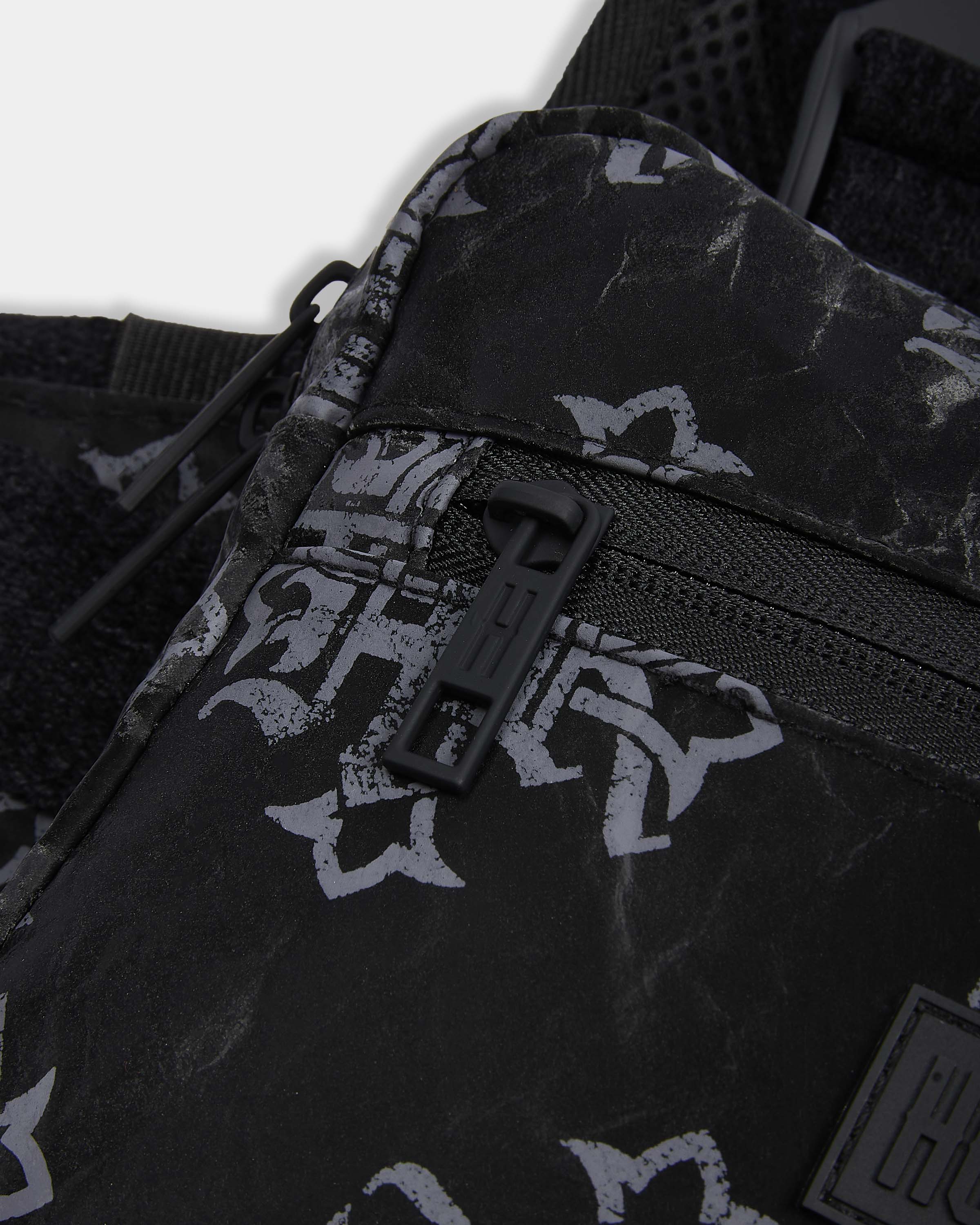 Black bag with white patterns and a visible brand logo on a white background
