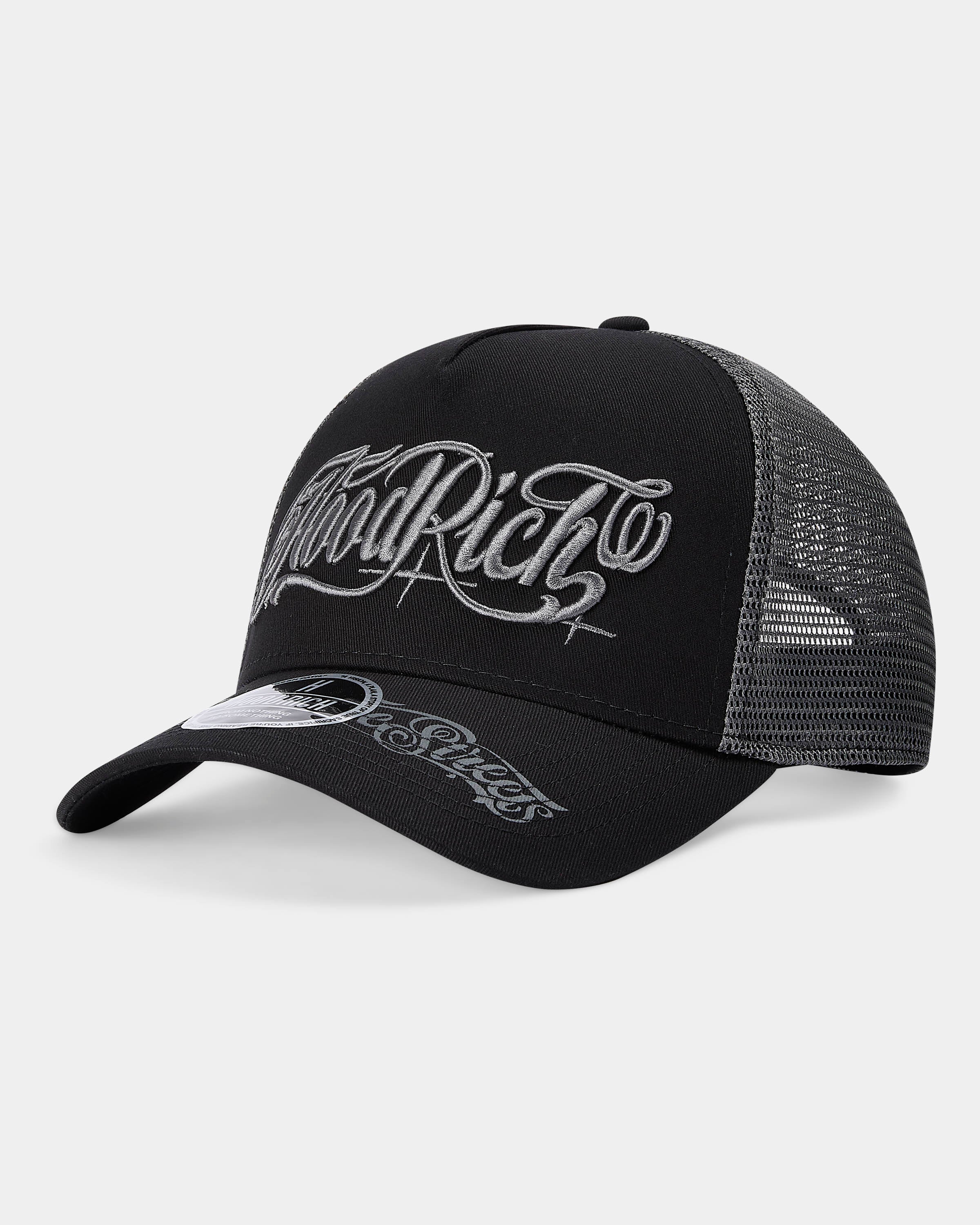 Black and gray trucker cap with white text on a light gray background
