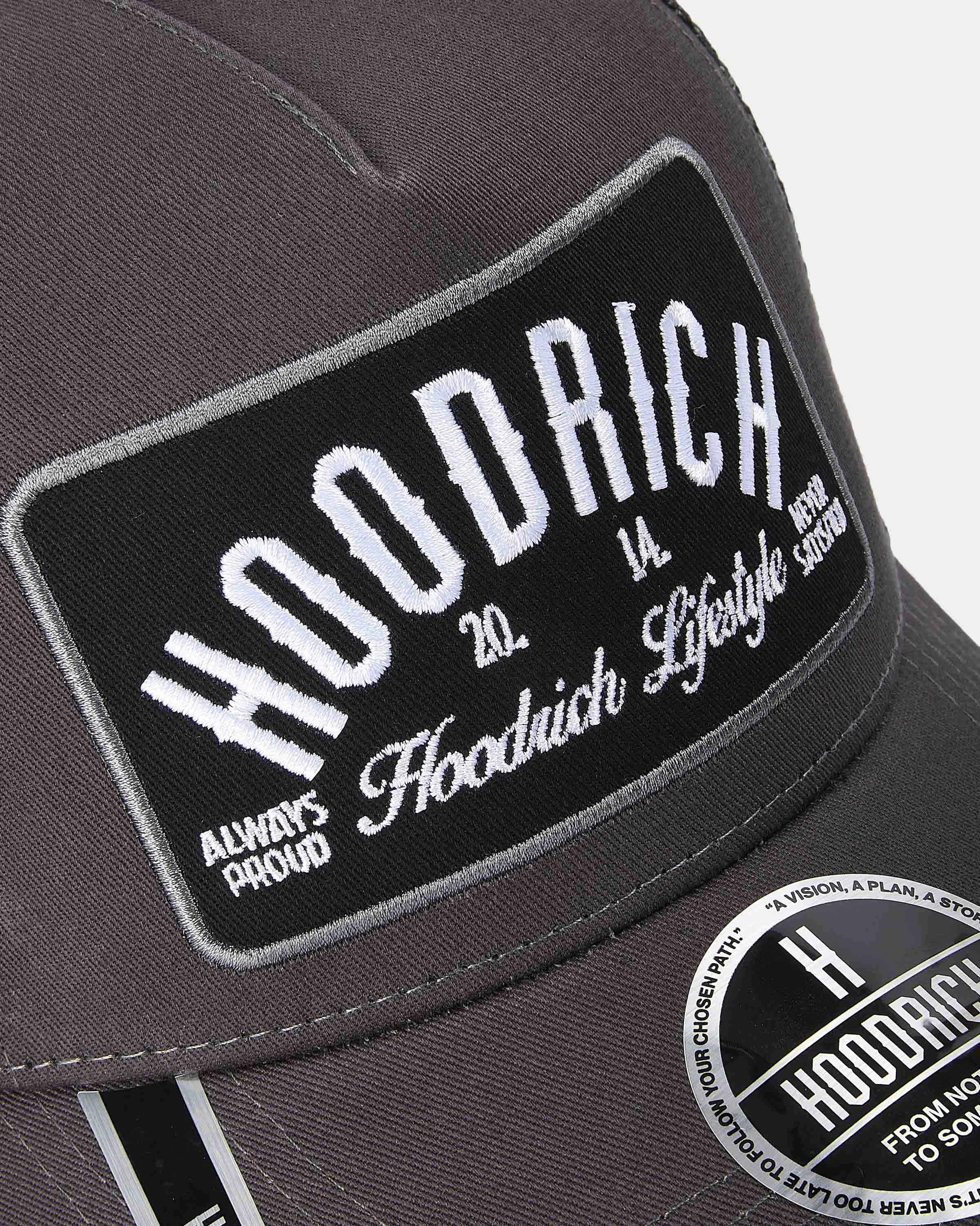 Gray cap with 'Hoodrich' branding and text on a white background