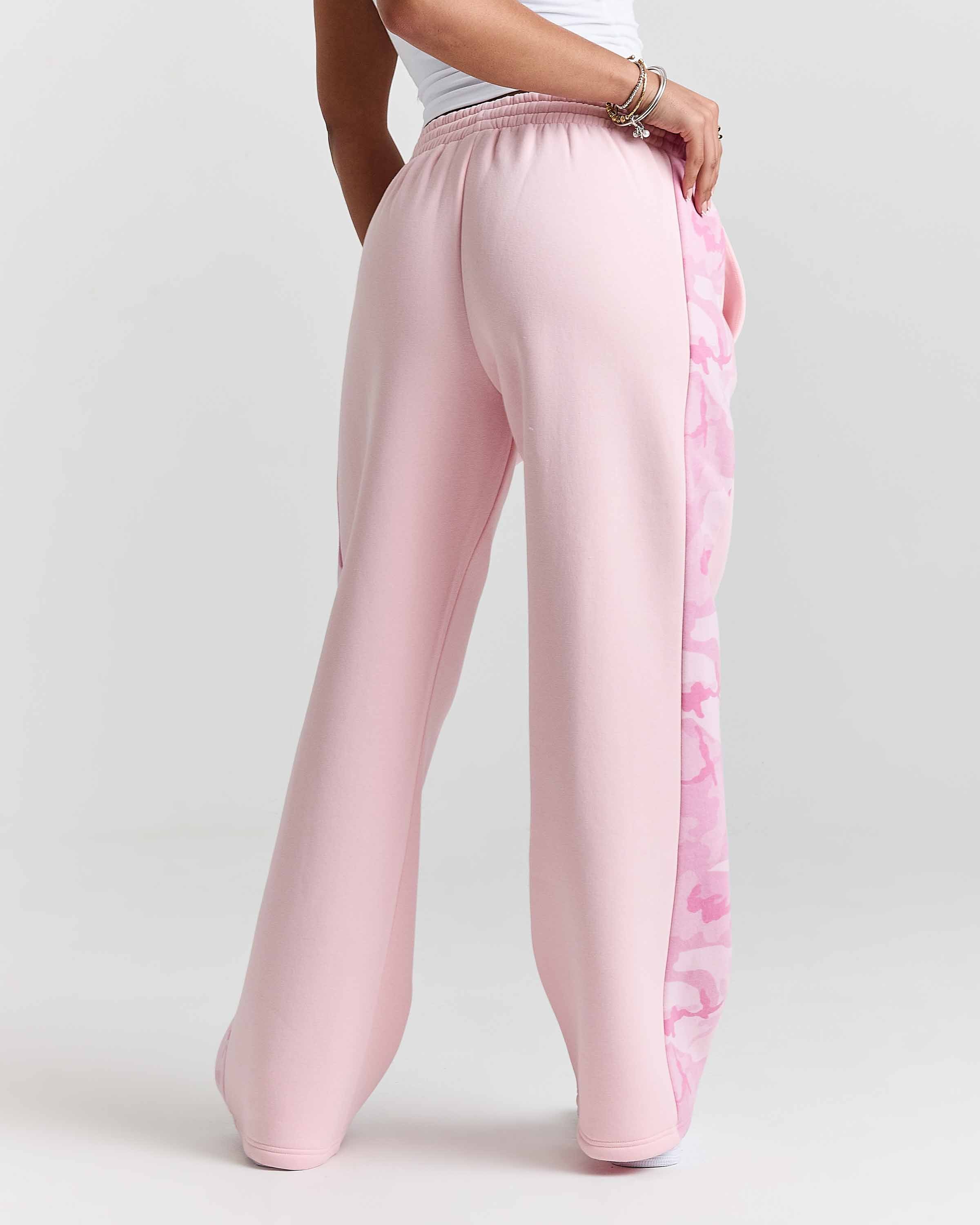 Displays a model wearing the Pink "Hoodrich' branded women's Field Full Tracksuit