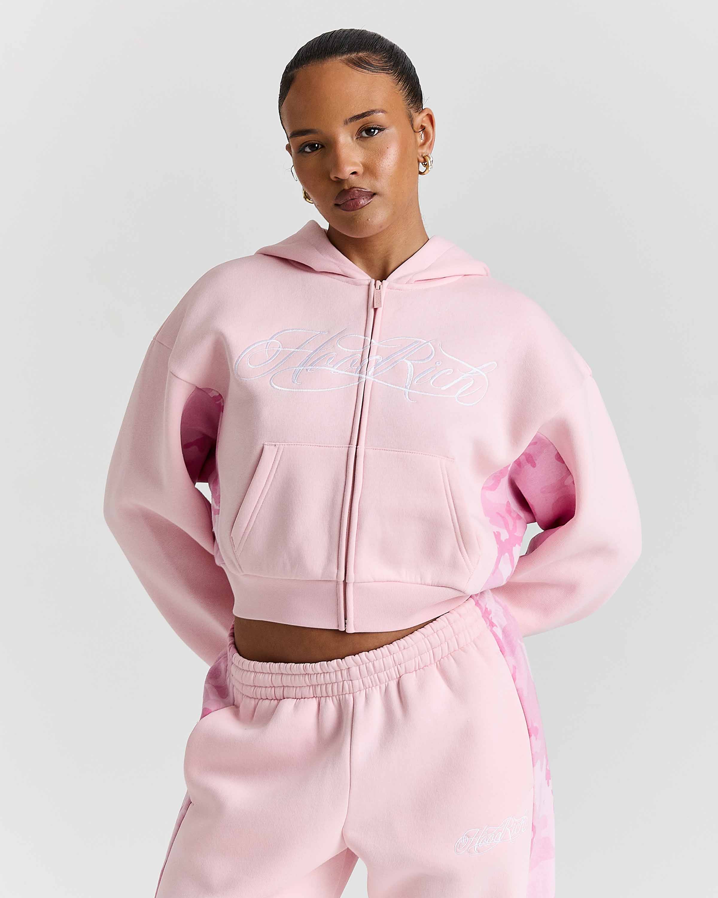 Displays a model wearing the Pink "Hoodrich' branded women's Field Full Tracksuit