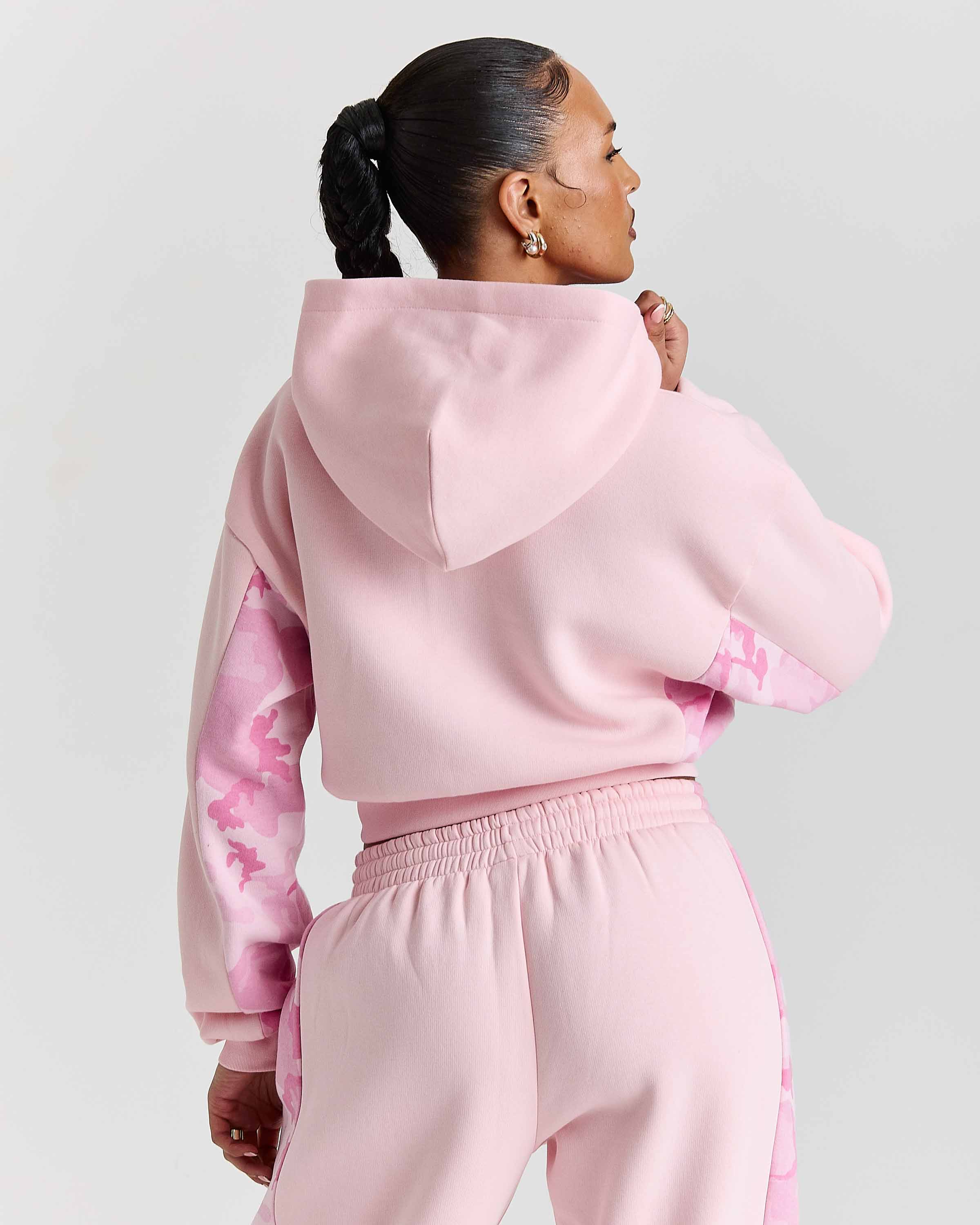 Displays a model wearing the Pink "Hoodrich' branded women's Field Full Tracksuit