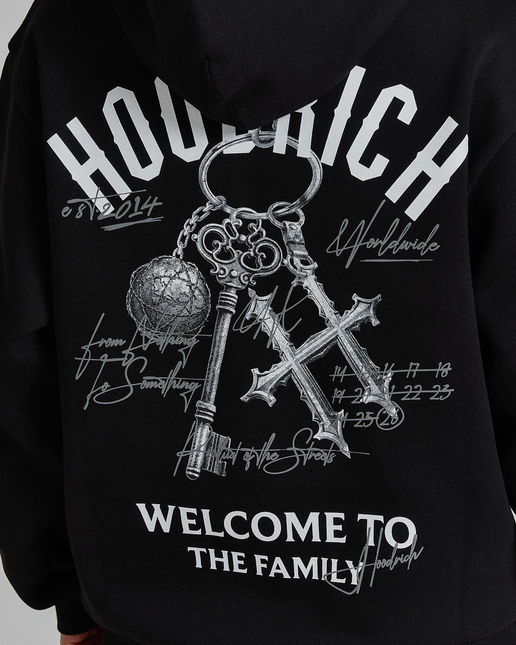 Black hoodie with white graphic design and text on a black background