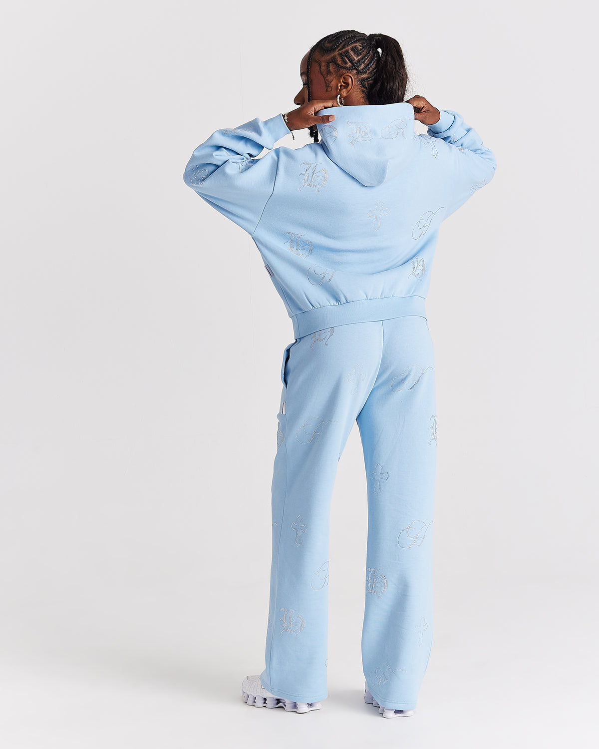 Displays a model wearing the blue 'Hoodrich' branded women's Crystal Full Tracksuit